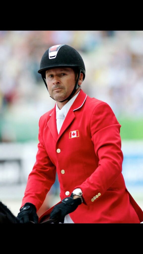 Canadian Olympic gold medalist Eric Lamaze wearing a team jacket by Alessandro Albanese